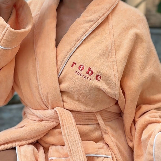 close up of peach coloured 100% terry towel bathrobe - Robe Society