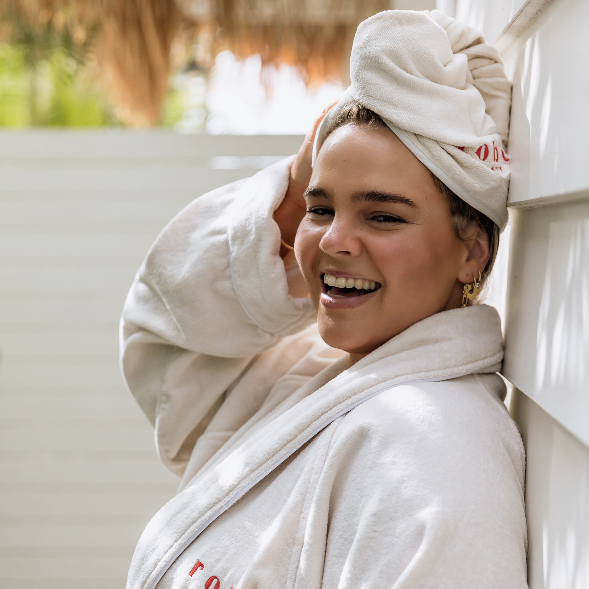 model outside wearing bathrobe and matching hair turban - Robe Society